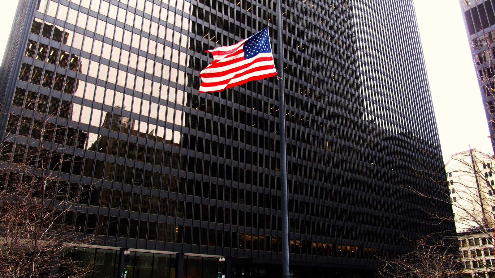 The Dirksen U.S. Courthouse in Chicago with an American flag in front