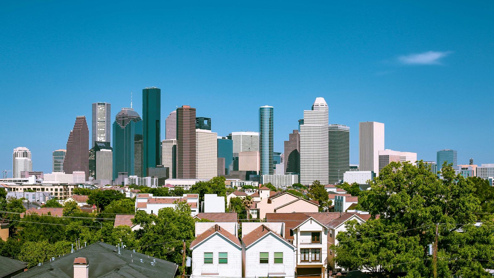 Townhomes in the foreground with the downtown Houston skyline behind