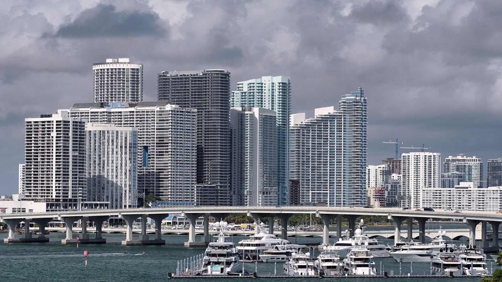 Miami high-rises above a marina seen across the water