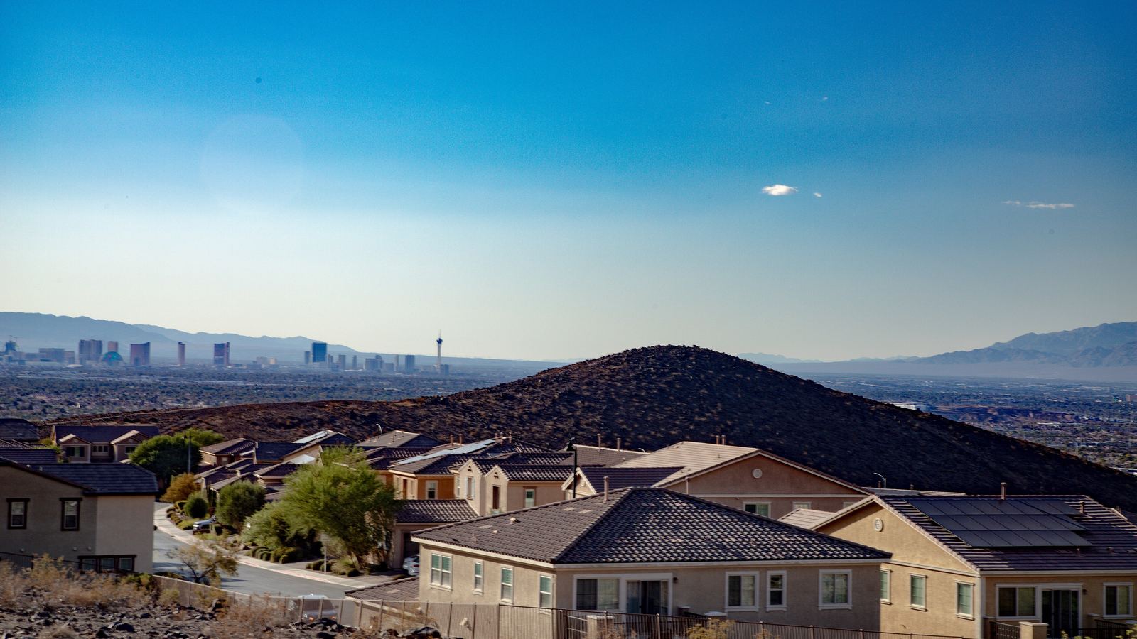 Stucco homes in Henderson, Nevada, with the Las Vegas Strip in the distance