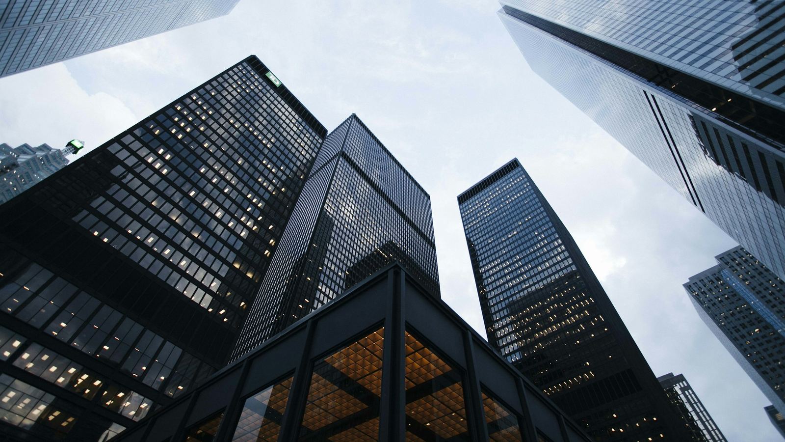 Glass office towers seen from street level