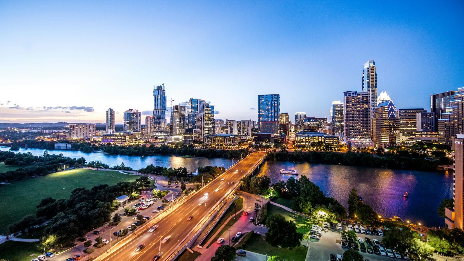 Downtown Austin skyline above Lady Bird Lake at dusk