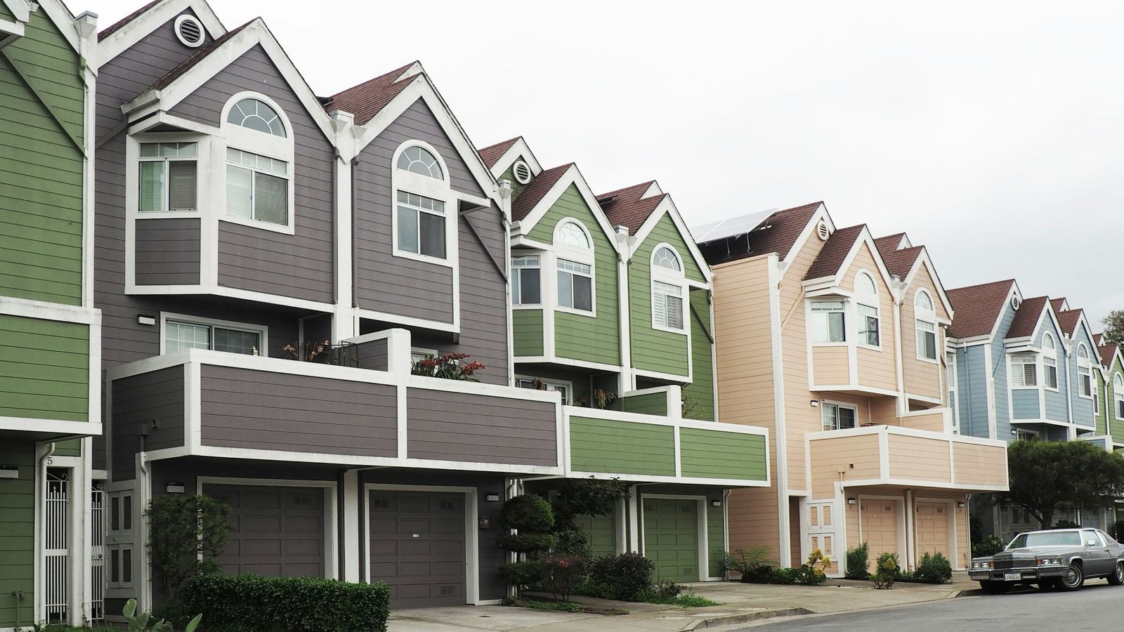 Row of attached townhouses painted in different colors