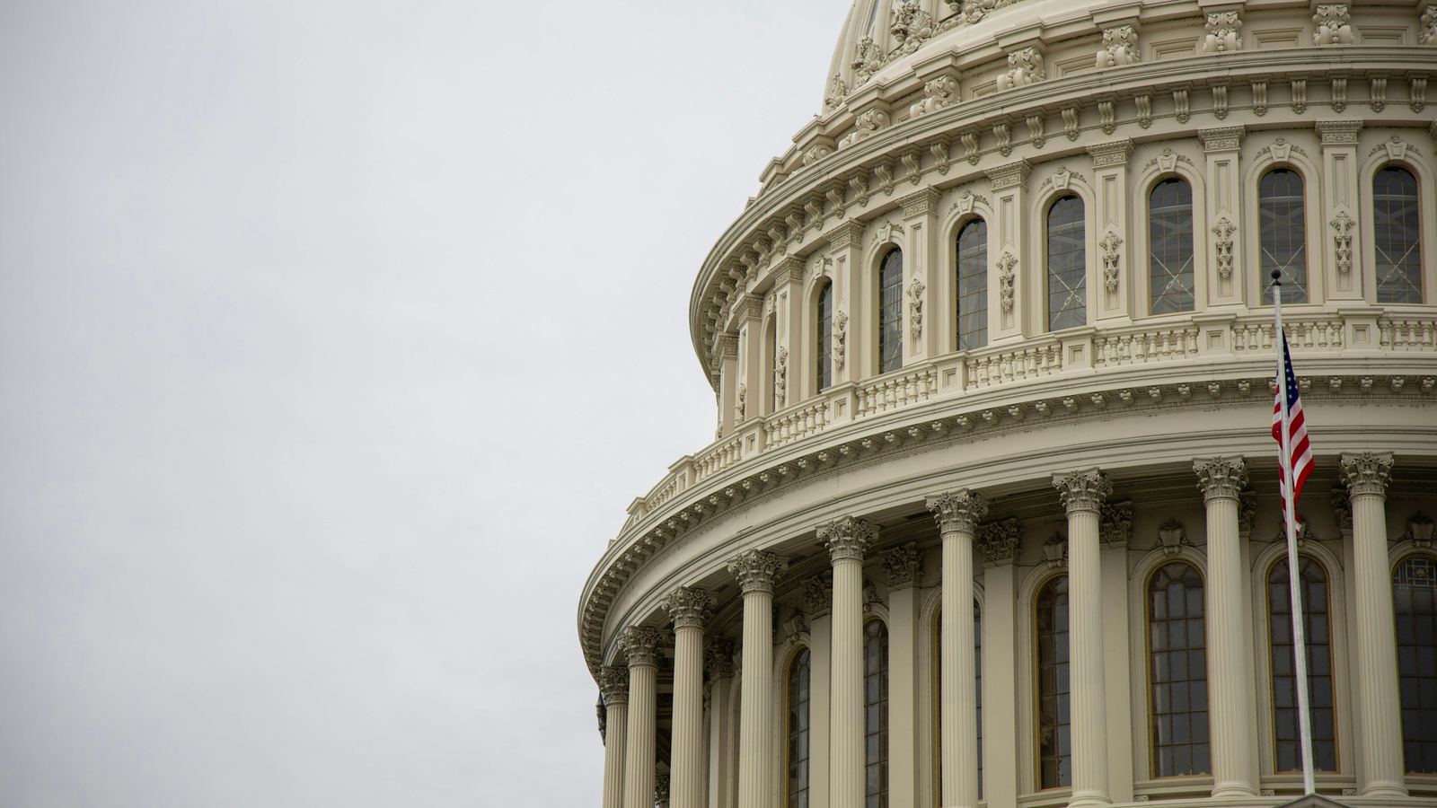 The U.S. Capitol dome with an American flag