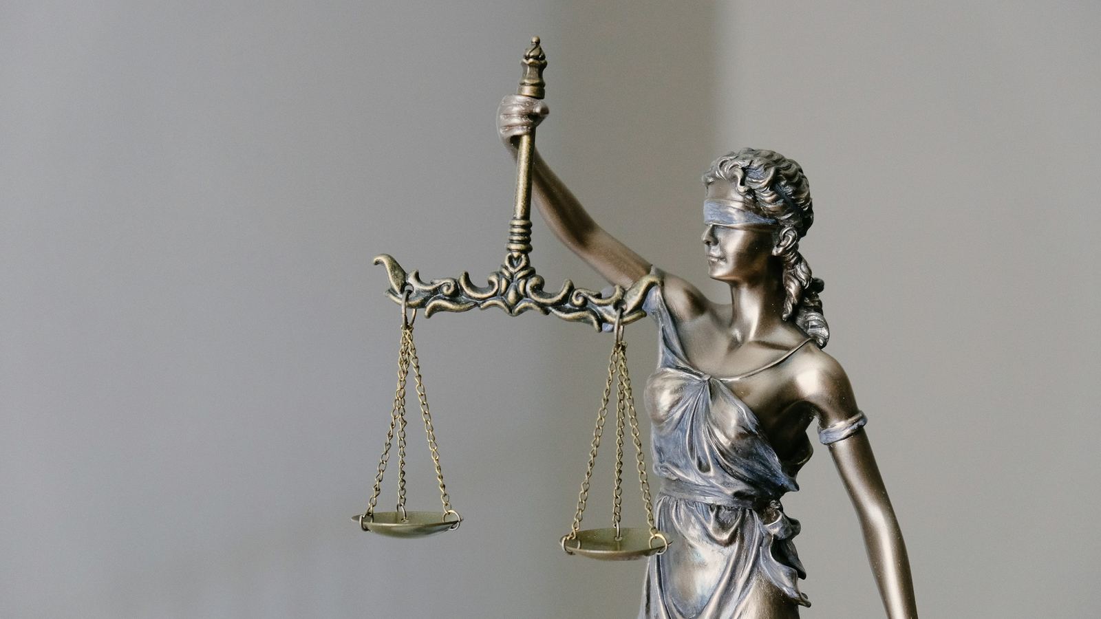 Bronze Lady Justice statuette holding scales